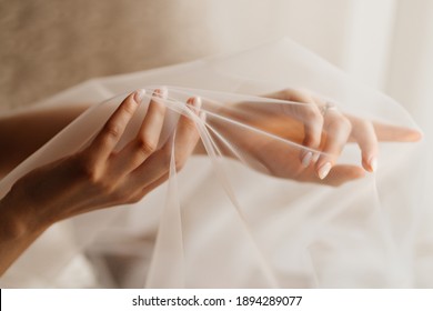 women's hands of the bride under the veil. Tenderness. wedding photo shoot. advertising of hand-care products. - Powered by Shutterstock