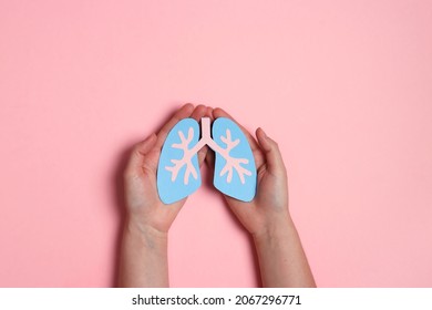 Women's Hands Hold A Lungs Symbol On Pink Background. World Tuberculosis Day. Healthcare, Medicine, Hospital, Diagnostic, Internal Donor Organ.