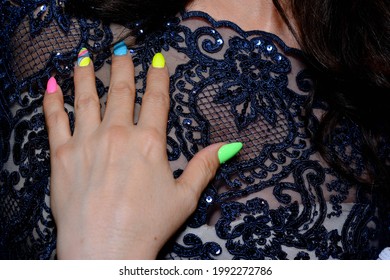 Women's Hands Of A Mature Woman With A Manicure Of Different Colors 