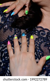 Women's Hands Of A Mature Woman With A Manicure Of Different Colors 