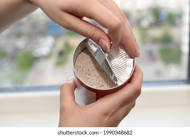 Women's Hands Opening The Lid Of A Jar Of Instant Coffee With Milk