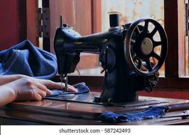 Women's hands of Seamstress Using Sewing Machine