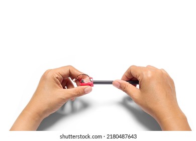Women's hands  sharpening pencils isolated on white background - Powered by Shutterstock
