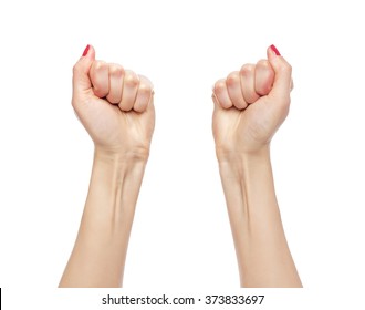 Women's hands. Two fists celebrating victory isolated on white background.