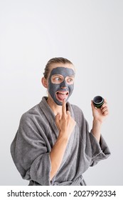 Womens Health. Spa And Wellness. Happy Funny Woman Applying Face Mask And Tasting It