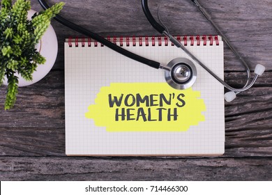 Women's Health Word On Notebook,stethoscope And Green Plant