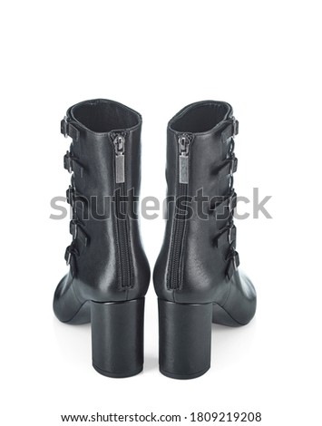 Women's high-heeled leather half boots with multiple straps and buckles on the top. Rear view.