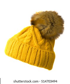 Women's knitted hat isolated on white background.hat with pompon . yellow hat .