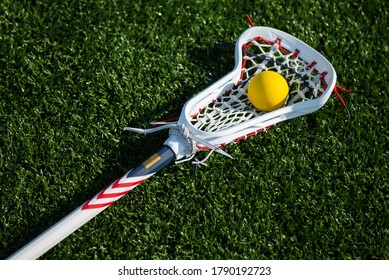 Women's Lacrosse Stick On A Field.