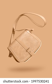 women's leather bag isolated on same colored background