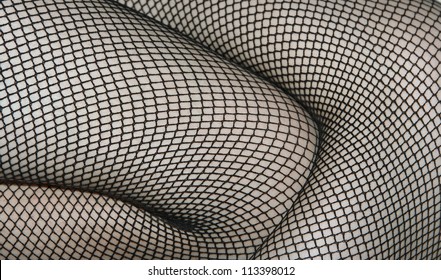 Women's Legs In Black Fishnet Stockings Texture