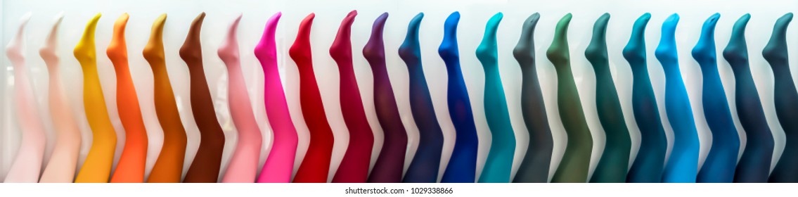 Women's mannequins legs in colored pantyhose.