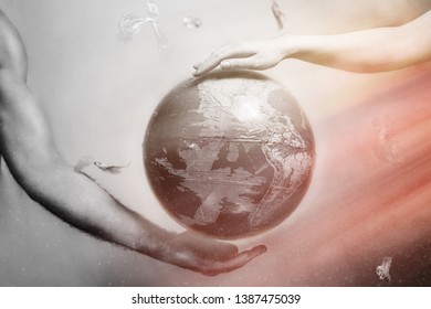 Women's and men's hands support the globe of planet Earth. Around the flying plastic debris. The concept of preserving the earth's environment.Red and white drammatic tint.