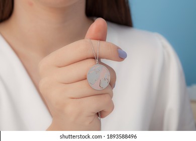 women's necklace in white outfit in front of a blue background - Shutterstock ID 1893588496