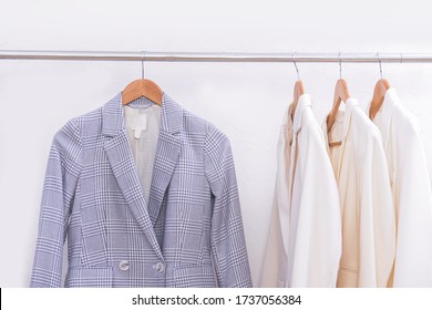 Women's Office Classic Jacket,striped And Three White Suit Hang On A Hanger

