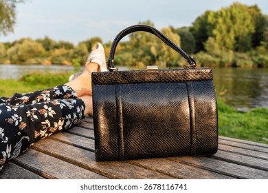 Women's python leather bag at the feet fashion, travel, rest, weekends