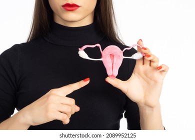 Women's Reproductive And Sexual Health.  Uterus And Ovaries In The Hands Of A Woman. Female Health Symbol. Maternity And Pregnancy Sign. Menopause, Urinary Incontinence, Care For Women Sexual Health 