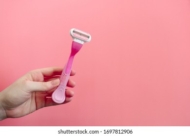 women's shaving machine pink background - Shutterstock ID 1697812906