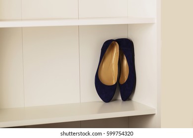 Womens Shoes (flats) On The Shelf In The Closet. Selective Focus.