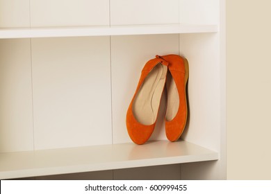 Womens Shoes (flats) On The Shelf In The Closet. Selective Focus