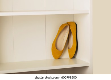 Womens Shoes (flats) On The Shelf In The Closet. Selective Focus