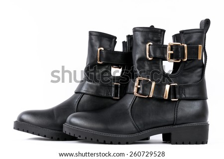 Women's shoes type ankle boot in black leather, photographed on white background