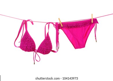 Women's swimsuit hanging on a rope on white background