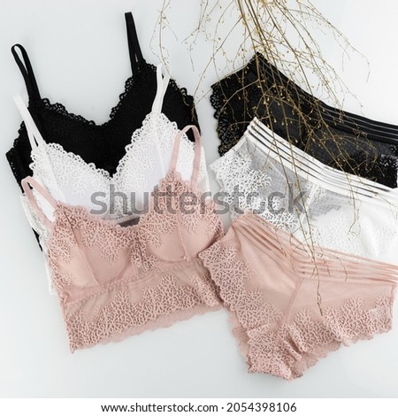 women's underwear, bra, underpants, white, black, beige fishnet, layout on a white background