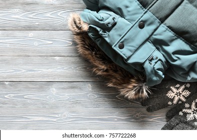 Women's warm winter clothing and accessories  - jacket and gloves. Wish list or shopping overview concept.  Fashion concept. View from above. Flat lay