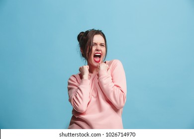 I won. Winning success happy woman celebrating being a winner. Dynamic image of caucasian female model on blue studio background. Victory, delight concept. Human facial emotions concept. Trendy colors - Shutterstock ID 1026714970