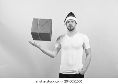 It Is Wonder. Magic Present From Sexy Man. Xmas Present Box. Boxing Day Concept. Macho Man After Shopping. Gift For You. Happy New Year. Christmas Shopping Time. Attractive Santa Deliver Your Gift