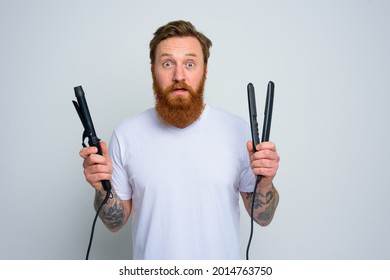 Wondered Man With Hair Straightener Is Ready To Work