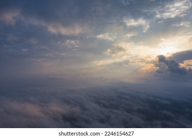 A wonderful bright dawn, above the clouds. Drone flight over the dawn.