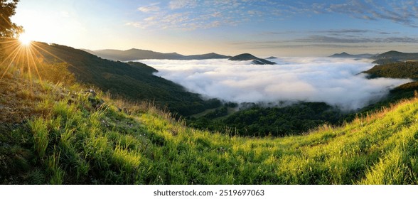 Wonderful foggy misty autumn morning with colorful dawn sunrise in Czech Central Mountains, hills above inversion and low clouds in Elbe river valley canyon - Powered by Shutterstock