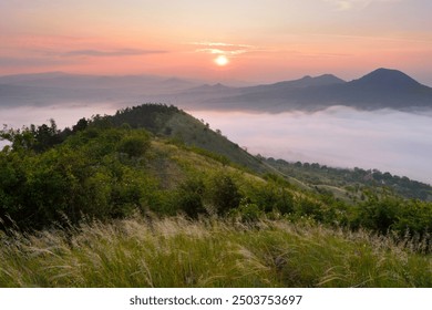 Wonderful foggy misty morning with colorful dawn sunrise in Czech Central Mountains, hills above inversion - Powered by Shutterstock