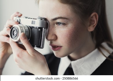 wonderful girl with freckles and vintage camera - Powered by Shutterstock