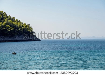 Wonderful landscape of Korcula island bay at Pupnatska Luka beach with view on Lastovo island visible in hazy distance across the sea in croatian part of Adriatic