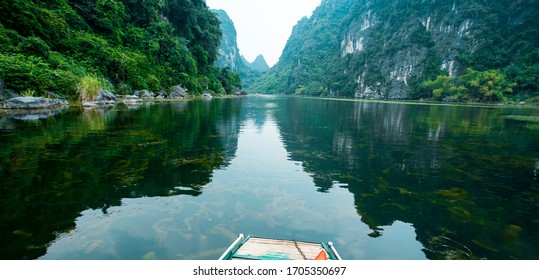 Wonderful landscape in Ninh Binh, Vietnam. Spectacular landscape in Ninh Binh with mountains, caves, river, reflection. Famous natural landscape in Trang An, Vietnam