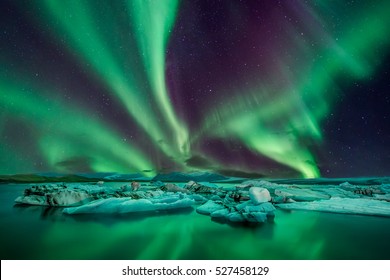 A wonderful night with Kp 5 northern lights flying over the Glacier Lagoon in iceland
 - Shutterstock ID 527458129