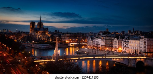 A Wonderful Night View Of Paris, Capital Of France. Where Its Buildings, Streets And Bridges Sparkle With Yellow Light