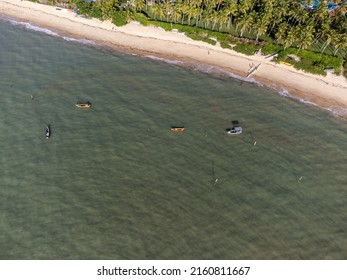 Wonderful Paradise Beach With The Summer Sun Rising In The Middle Of The Atlantic Forest. Tourist Town Arraial D'Ajuda, Brazil, South America. Aerial Drone View.