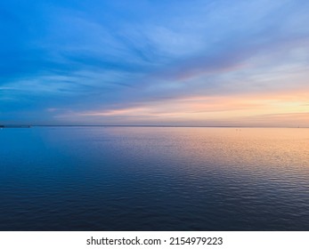 Wonderful peaceful sunset at the sea, seascape background, tender and natural colors 