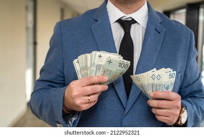 A Wonderful Refined Man Holds Polish Zlotys In His Strong Hands. The Concept Of High Income