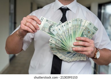 A Wonderful Refined Man Holds Polish Zlotys In His Strong Hands. The Concept Of High Income