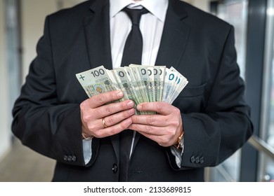 A Wonderful Refined Man Holds Polish Zlotys In His Strong Hands. The Concept Of High Income