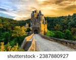 wonderful romantic Medieval castles  of Germany in autumn colours over sunset Burg Eltz, one of the most beautiful in Europe