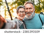 Wonderful sincere cheerful couple of gray haired mature smiling people taking selfie portrait on phone. Today