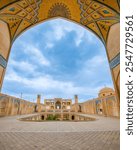 Wonderful view of Agha Bozorg Mosque on blue sky background in Kashan, Iran. The historical mosque and madrasa is a popular tourist attraction of the Middle East.