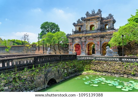 Wonderful view of the East Gate (Hien Nhon Gate) to the Citadel and a moat surrounding the Imperial City with the Purple Forbidden City in Hue, Vietnam. Hue is a popular tourist destination of Asia.