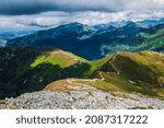 Wonderful view on mountains slope illuminated by sun. Mountain pass (Gaborowa Przelecz or Gaborovo sedlo) in Tatras, border Poland, Slovakia. Picturesque trail. Majestic scenery in Carpathians, Europe